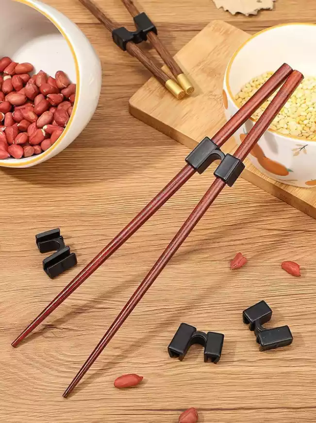 مثبت عيدان تناول الطعام